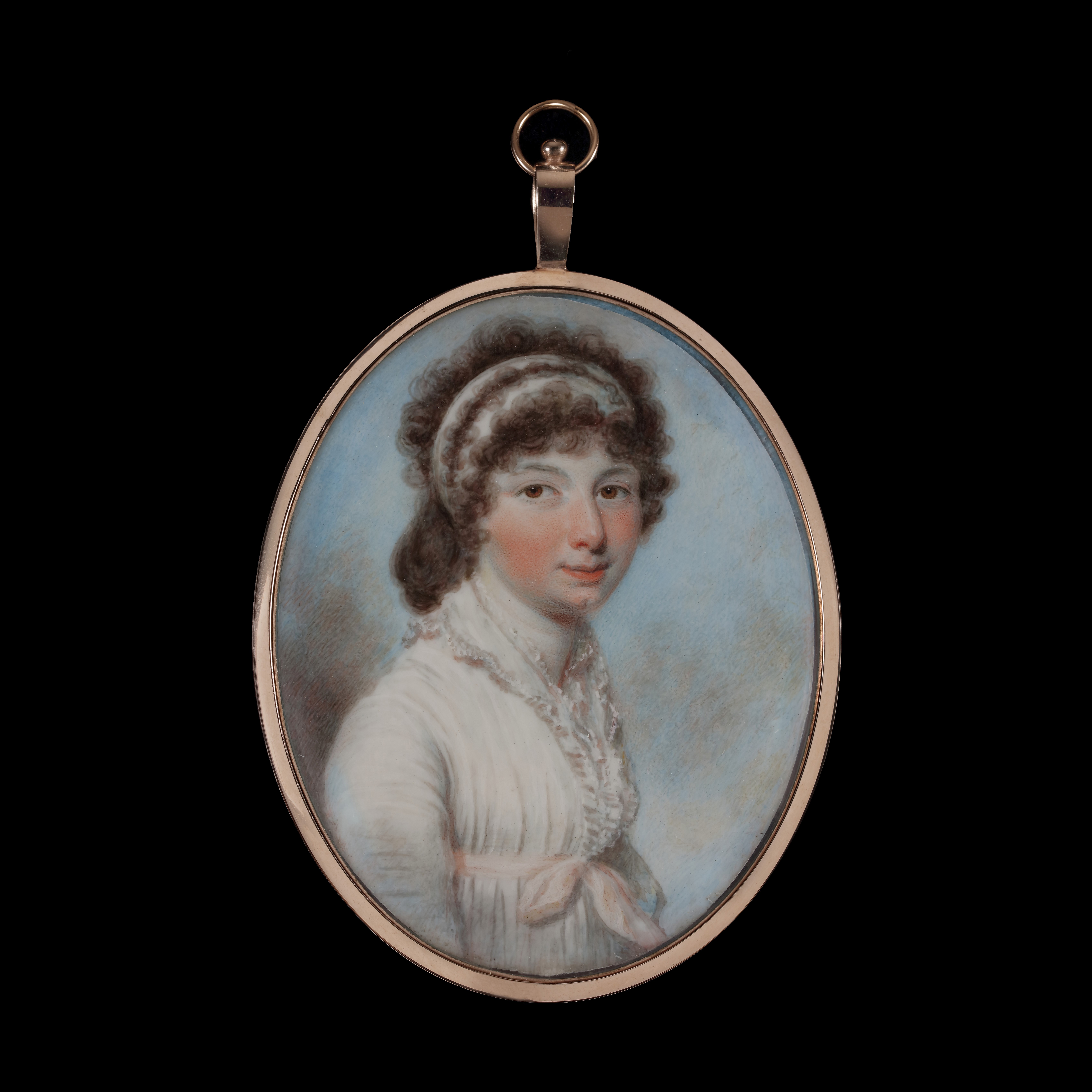 A portrait miniature of a Lady, wearing white dress with pale pink sash